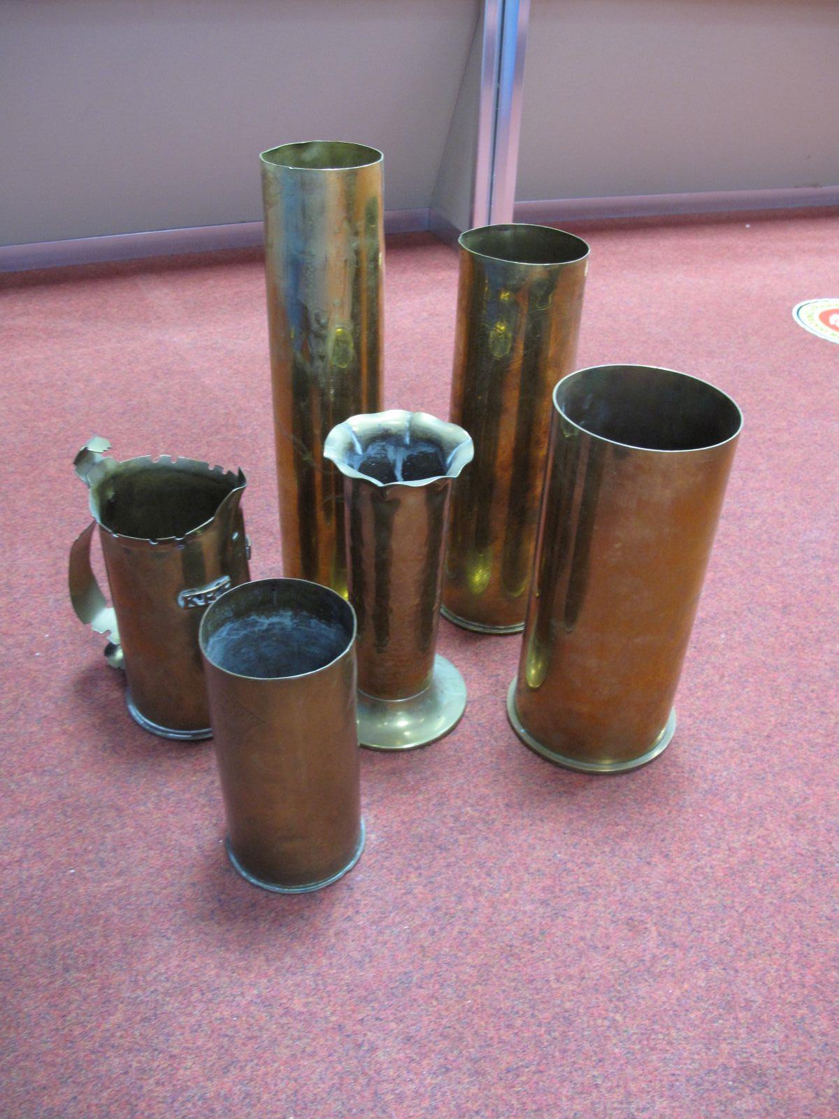 Six WWI and Leather Brass Shell Cases, sometimes worked as trench art.