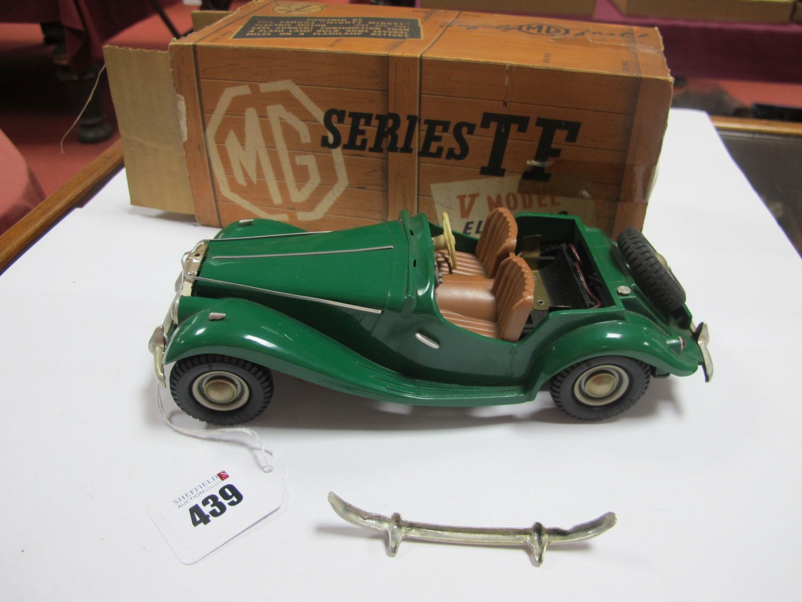 A Victory Industries MG Series TF, in green, extra bumper present (boxed).