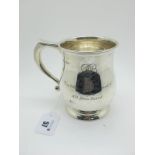 A Hallmarked Silver Mug, Mappin & Webb, Sheffield 1963, of plain baluster form with scroll handle,