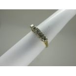 An 18ct Gold Five Stone Diamond Ring, the brilliant cut stones claw set (finger size P1/2).