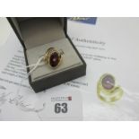 A Modern Lehrer Torus Garnet and Diamond Set Cocktail Ring, of abstract design, oval semi collet