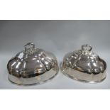 A Graduated Pair of Plated on Copper Meat Domes, (stamped bell mark) each of shaped design, with