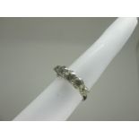 An 18ct White Gold Five Stone Diamond Ring, claw set with graduated old cut stones (chips) (finger