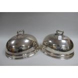 A Pair of Oval Plated Meat Domes, (stamped bell mark and "I.B") each of plain oval form with