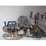 Assorted Plated Ware, including twin branch candelabra, set of circular place mats, bell, sugar