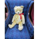 A Fully Jointed Gold Plush Teddy Bear, with pad feet and hands, black stitch nose and mouth, 61cm