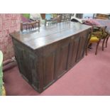 An Early XVIII Century Joined Oak Blanket Box, with hinged lid, four panelled base, panelled ends,