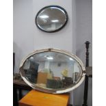 An Oval Bevelled Wall Mirror, in painted frame, stamped 'LNER', 42cm wide, Painted oak framed wall