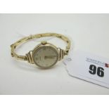 Timor; A 9ct Gold Cased Ladies Wristwatch, the signed dial with Arabic numerals and dot markers,