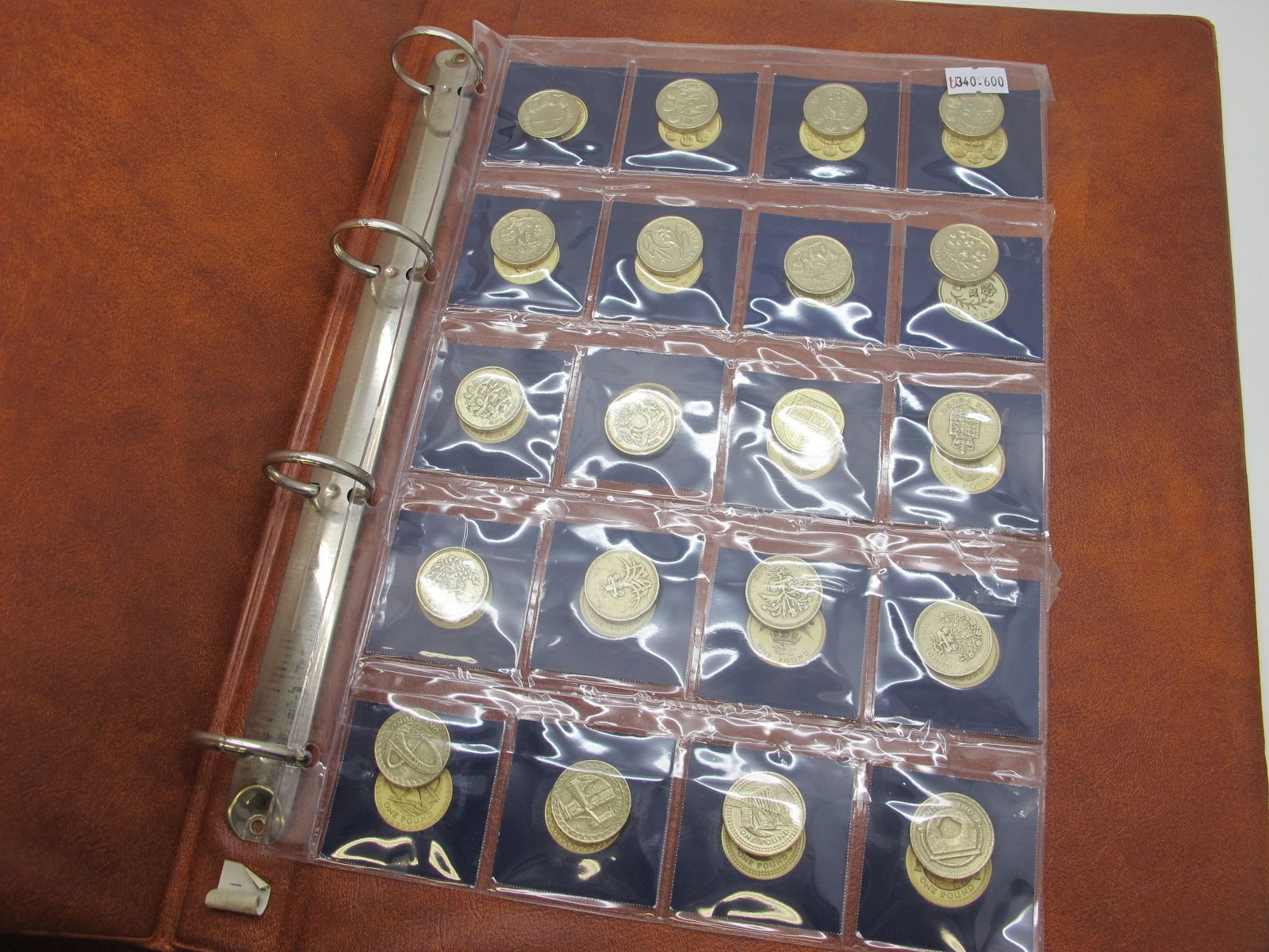 A Folder Containing Twenty 'Old Round Pound' Coins, includes Millennium Bridge, Menai Bridge,