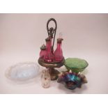 Five Cranberry Bottle Cruet Set, in plated stand, glass bowl with milky cruciform design, carnival