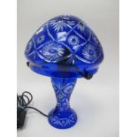 An Edwardian Style Blue Glass Table Lamp, with incised star shaped designs, 35cm high.