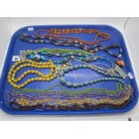 A Small Collection of Various Bead Necklaces, including hardstone, decorative, amber coloured,