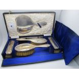 A Hallmarked Silver Backed Dressing Table Set, in original fitted case with matching comb (teeth