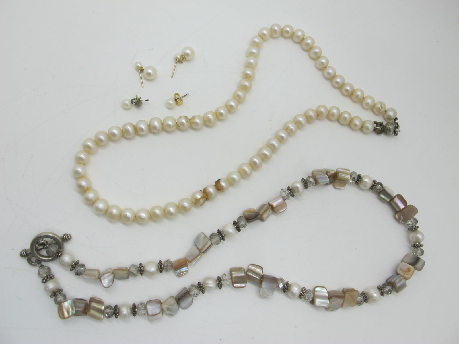 A Single Strand Pearl Bead Necklace, another similar of modern style, together with two pairs of