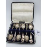 A Decorative Set of Six Hallmarked Silver Teaspoons, each of pierced design, in a fitted case.