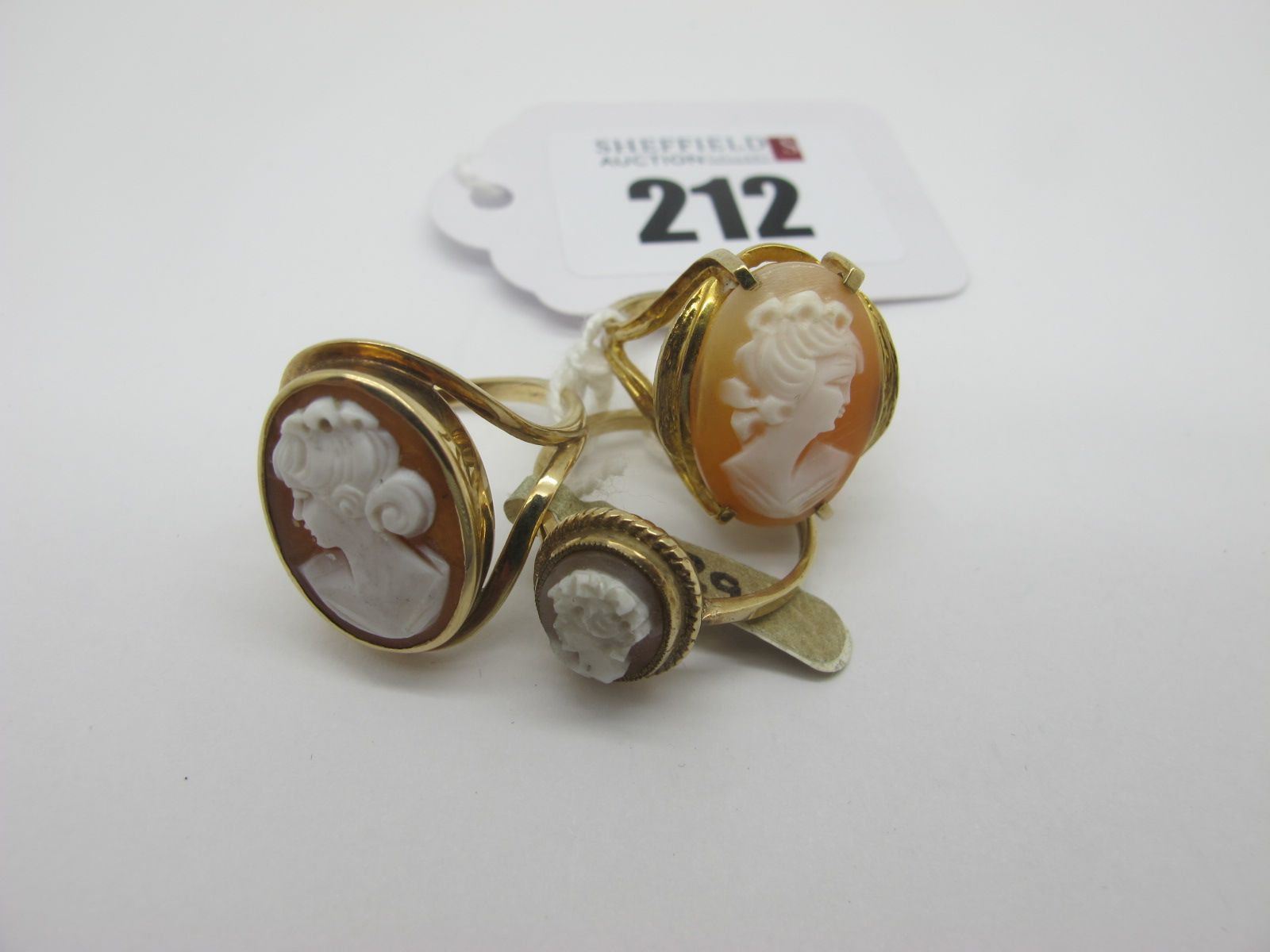 A 9ct Gold Oval Shell Carved Cameo Ring, (finger size L); together with another example, stamped "