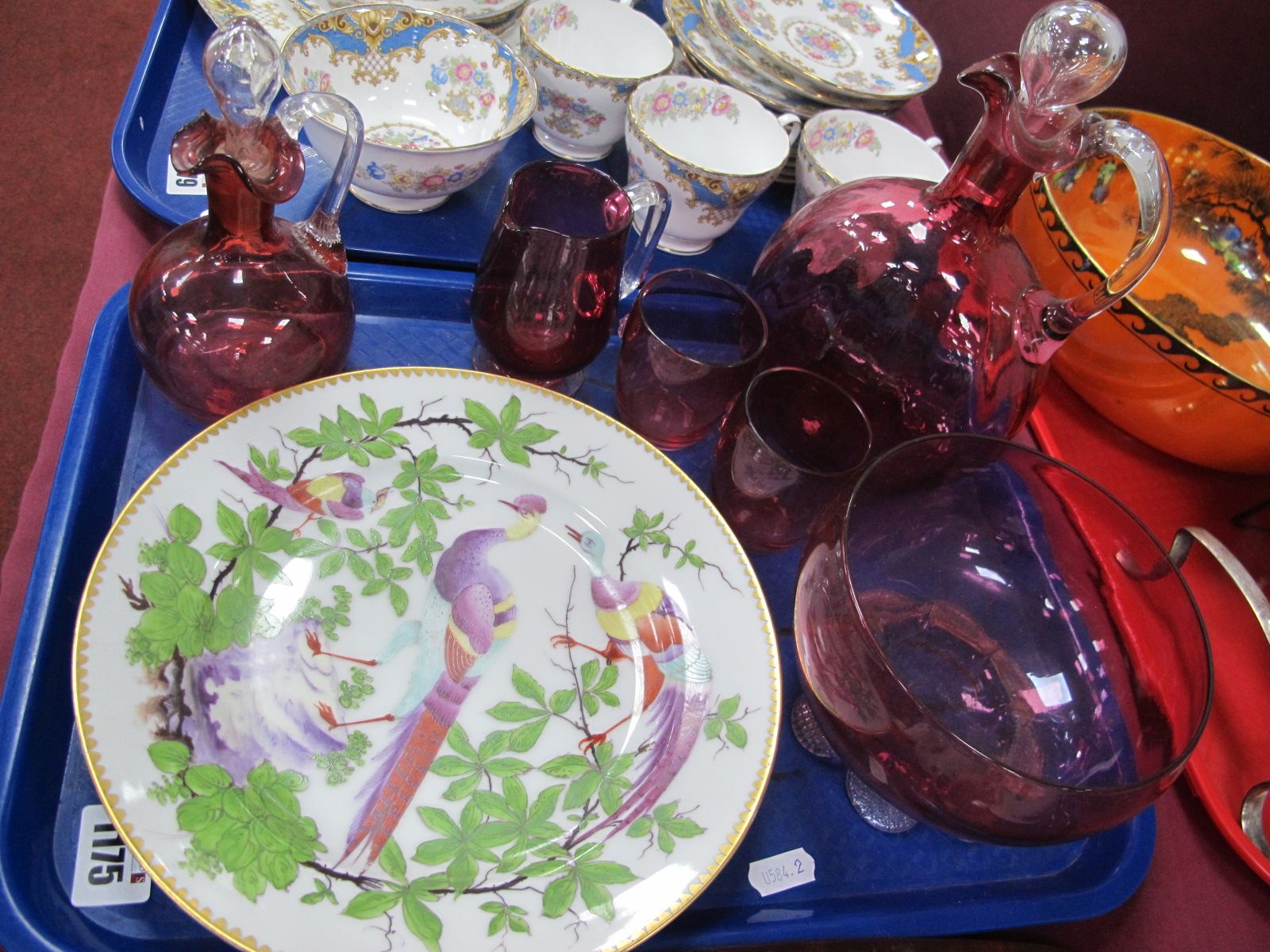 A XIX Century Cranberry Glass Decanter, oil bottle, jug, bowl and two tumblers, XIX Century hand