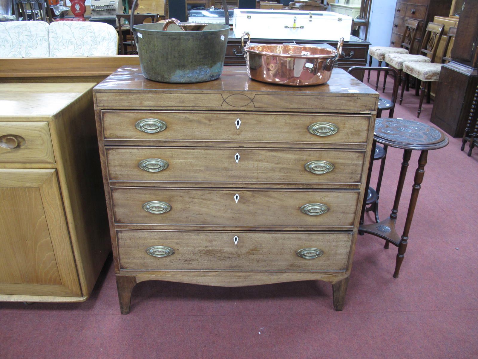 An Early XIX Century Mahogany Straight Front Chest of Four Graduated Drawers, having brass handles