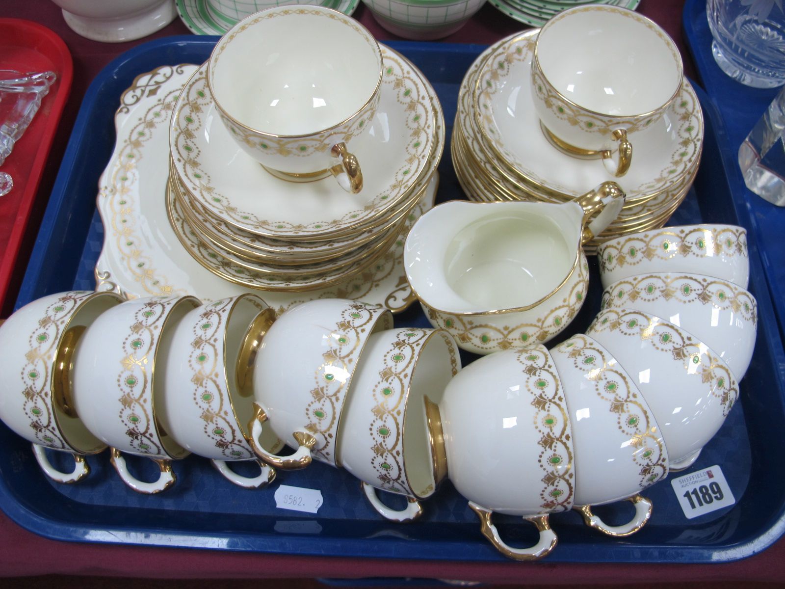 Tuscan Plant Tea Ware, of thirty three pieces, gilt scrollwork with green dot decoration on cream