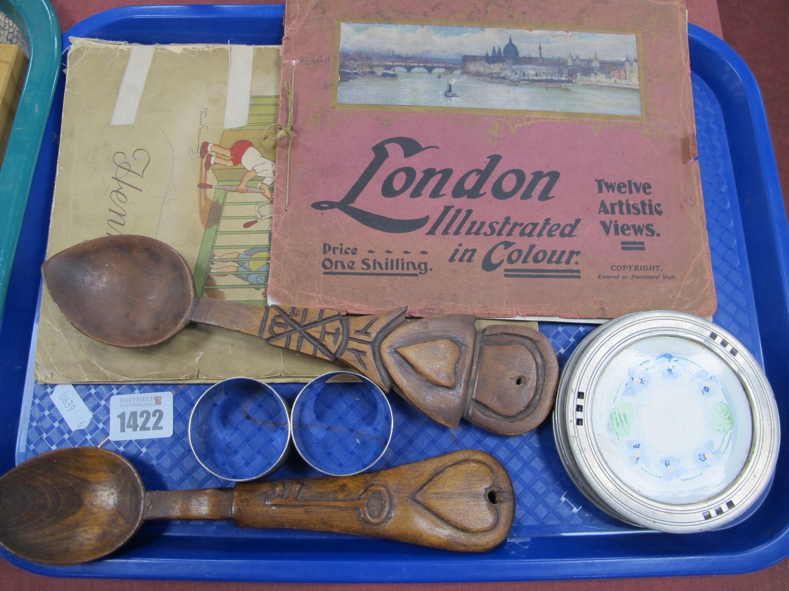 Two Silver napkin Rings, love spoons, Geschutz coasters, Wix cigarette cards, London Views booklet:-