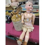 Heybach Koppelsdorf Pottery Headed Doll, (hair absent) approximately 59cm high. Botanic Brewery of