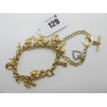 A Modern 9ct Gold Charm Bracelet, suspending assorted charm pendants; Together with A Curb Link