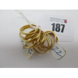 Ten 22ct Gold Wedding Bands, (all misshapen). (10)