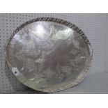 A Large Decorative Oval Plated Tray, allover foliate decorated, within gallery border of cherubs and