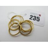 Eight 22ct Gold Wedding Bands. (8)