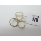 Two 9ct Gold Wishbone Rings, (approximate finger sizes M); together with another wishbone ring. (3)