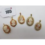 Two 9ct Gold Oval Shell Carved Cameo Pendants, of similar design; together with another example,