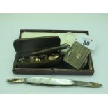 Gent's Cufflinks and Assorted Dress Studs, contained in a vintage tobacco tin, a vesta case with
