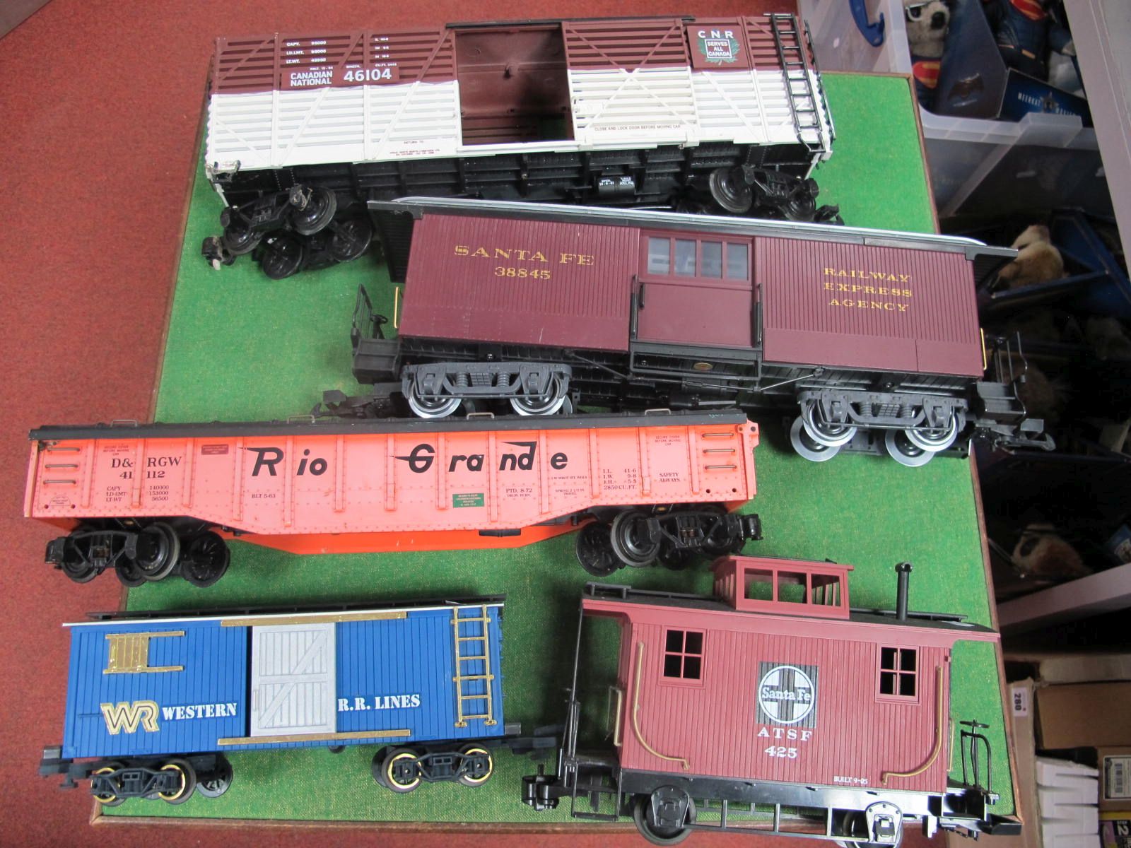 Five 'G' Gauge Unboxed Items of Rolling Stock, a Santa Fe Carboose and "Express Agency" van, four