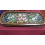 A XIX Century Ebonized and Walnut Display Tray, with curved ends, bead work inset top, (one foot