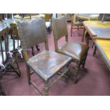 A Set of Seven Oak Dining Chairs (Six Single, One Carver), with acanthus leaf terminals, studded