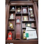 Collectors Treasury of Clocks, twelve miniature clocks by Franklin Mint, with certificates in wooden