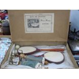 A Victorian Boxed Ping Pong or Gossima Set, comprising two velum faced bats, wooden/brass fitted net