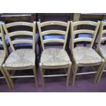 A Set of Six Rush Seated Light Wood Kitchen Chairs.