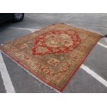 A Middle Eastern Tassled Carpet, with central medallion in the Indian manner, allover floral