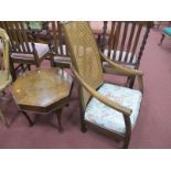 A 1920's Ash Bedroom Chair, with a caned back, swept arms on bun feet, together with an octagonal