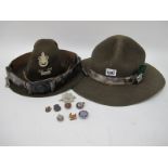 A Bukta Scouts Cap, one other, belt, eight badges.