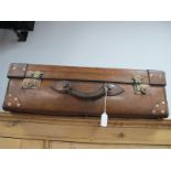 A Quality Heavy Early XIX Century Leather Suitcase, with brass locks and copper riveted leather