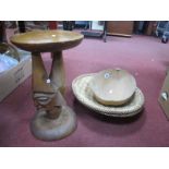 A Tongo Wood Stool, with carved head support and circular base, 42cm high, two Kuba circular