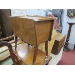 A XX Century Oak Sewing Box, with a sliding top, fitted interior.