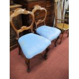 A Pair of XIX Century Mahogany Salon Chairs, with a scroll top rail, drop in seats, on cabriole