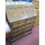 A XX Century Oak Moulded Front Bureau, with a fall front, fitted interior, with two small drawers,