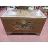 Camphor Wood Storage Chest, Oriental, heavily carved with figures and foliage, having brass lock