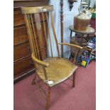 An Art Nouveau Ash and Mahogany Spindle Back Arm Chair, with inlaid splat, dish seat and bowed arms,