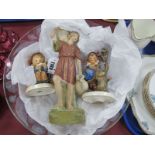 Royal Dux Figure of Water Carrier, in traditional pastel colours, 24.5cm high. Two Hummel figures, a